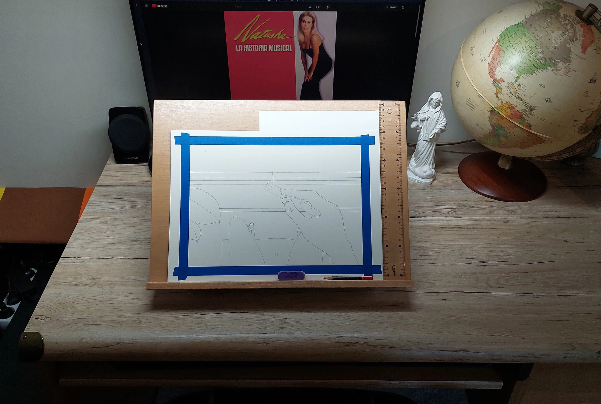 The Arches paper with the pencil sketch traced onto it, mounted on the table easel.
